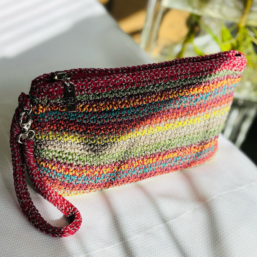 The Sak Casual Classics Striped Crochet Wristlet Sunset Stripe pattern. Like new